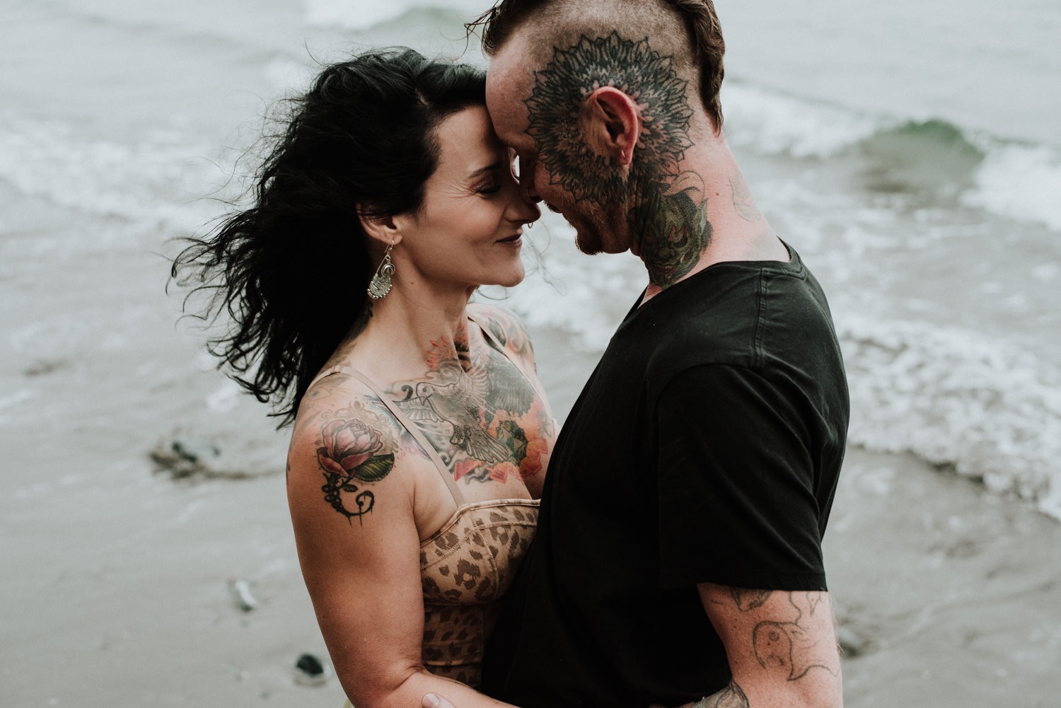 Cropped View Of Tender Tattooed Couple Embracing Free Stock Photo and Image