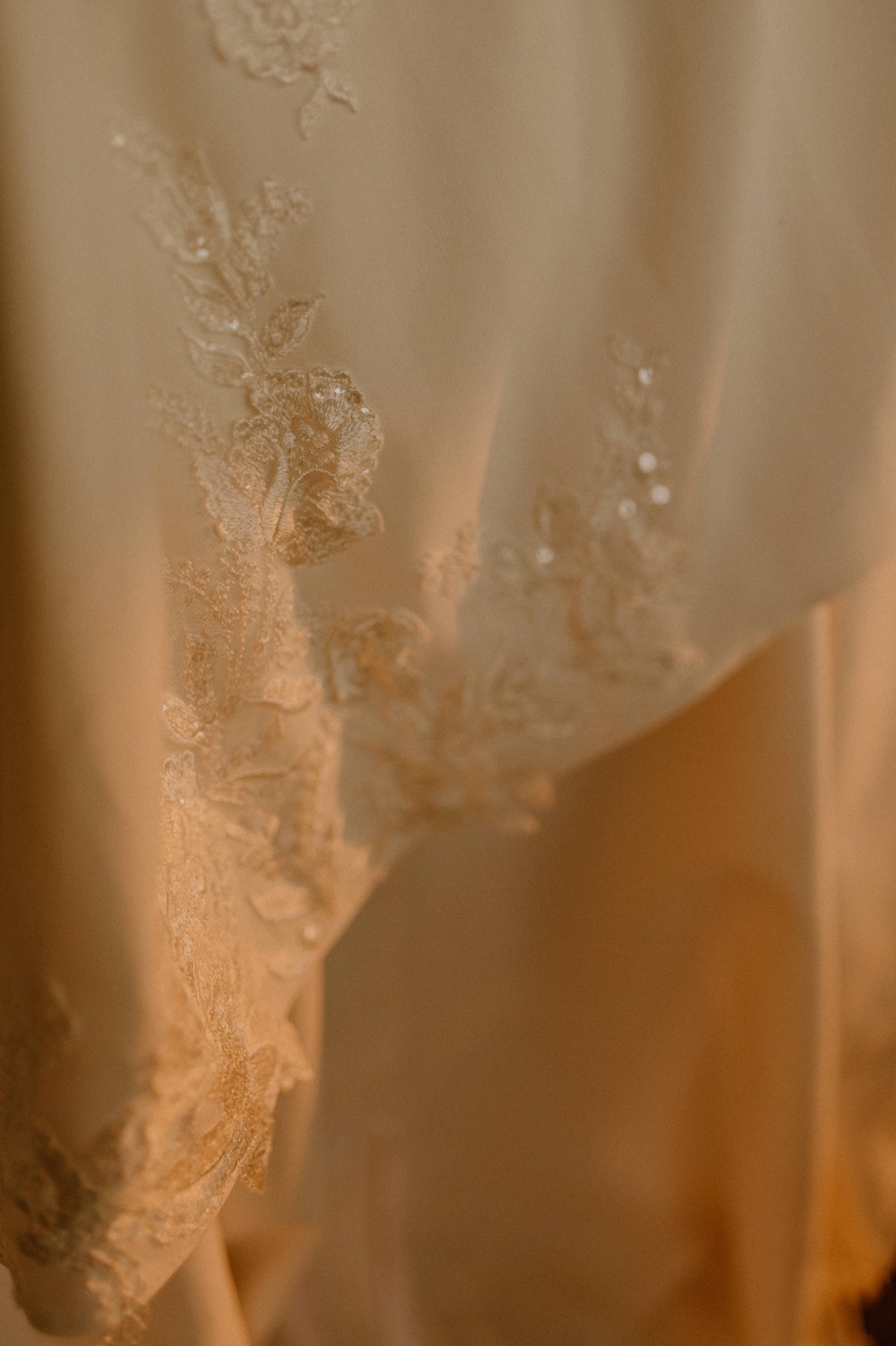 details of dress in the sunlight for a mountain elopement during wildfire season in Banff Alberta