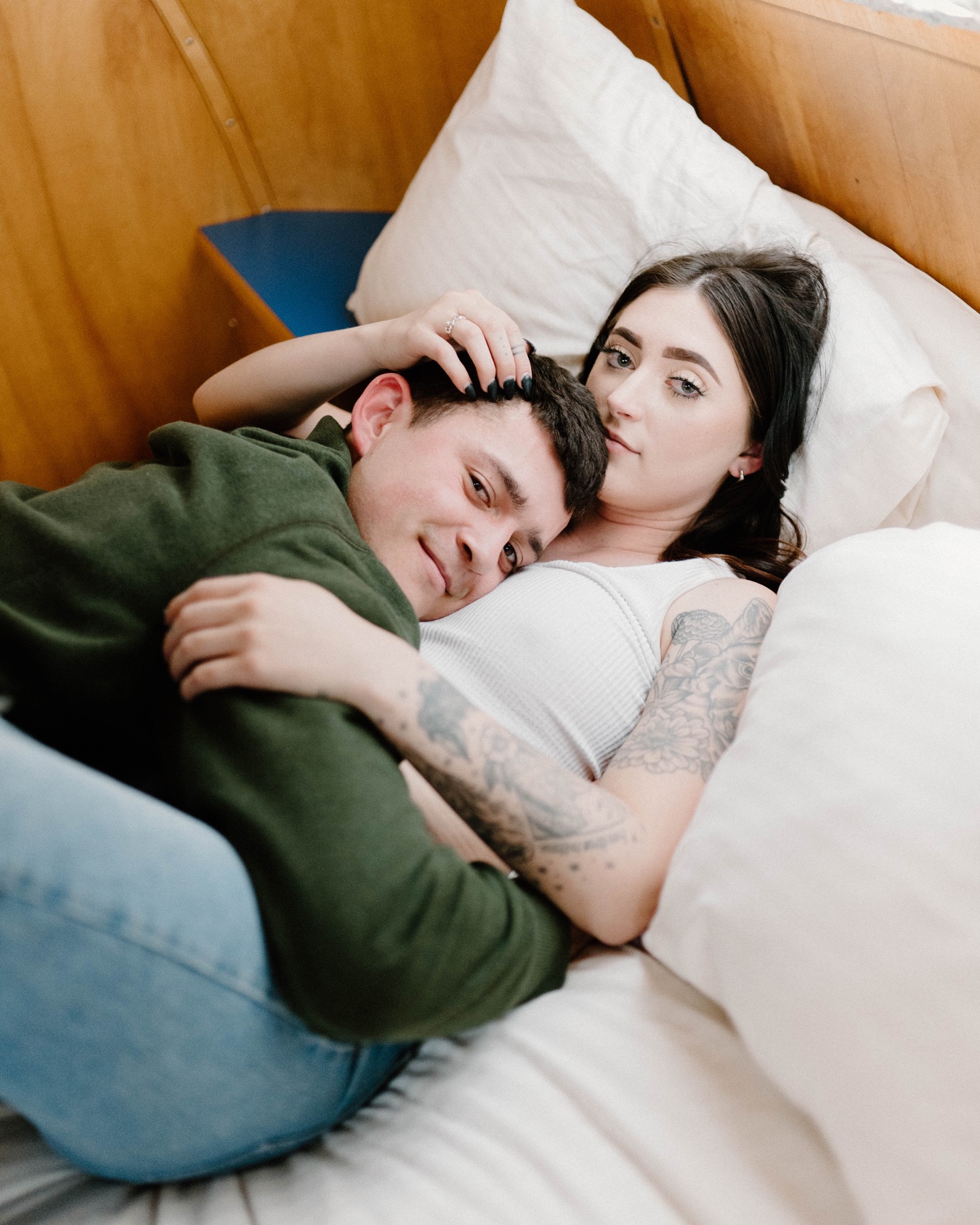 Cozy couples in home session posing on bed/couch. Photo by Erika Greene  Photography. | Couples, Couples in love, Couples engagement photos