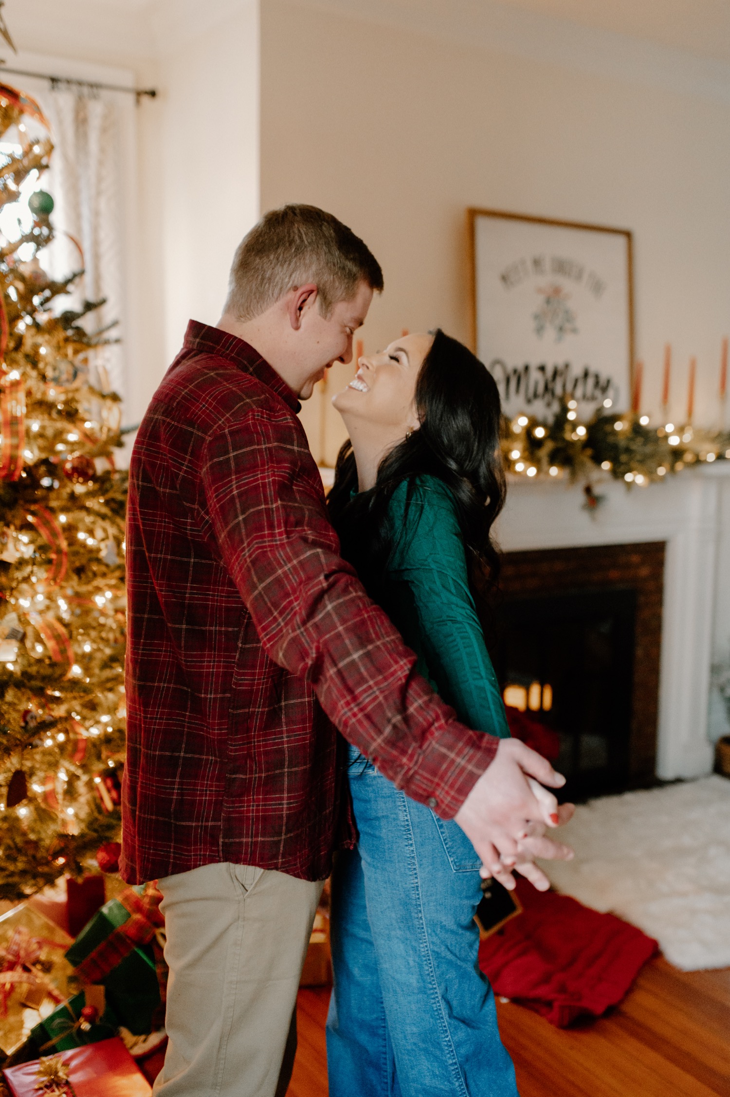 Couple of teenagers at Christmas. Boyfriend hugs a friend. Portrait in full  growth. In the background is a Christmas tree. Date for the holidays Stock  Photo - Alamy