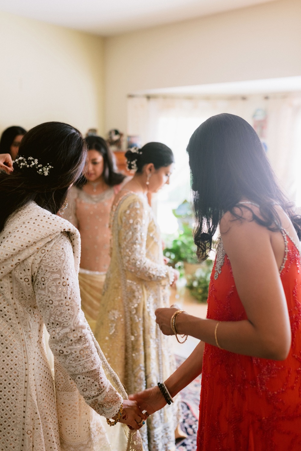 pakistani bride and groom holding hands