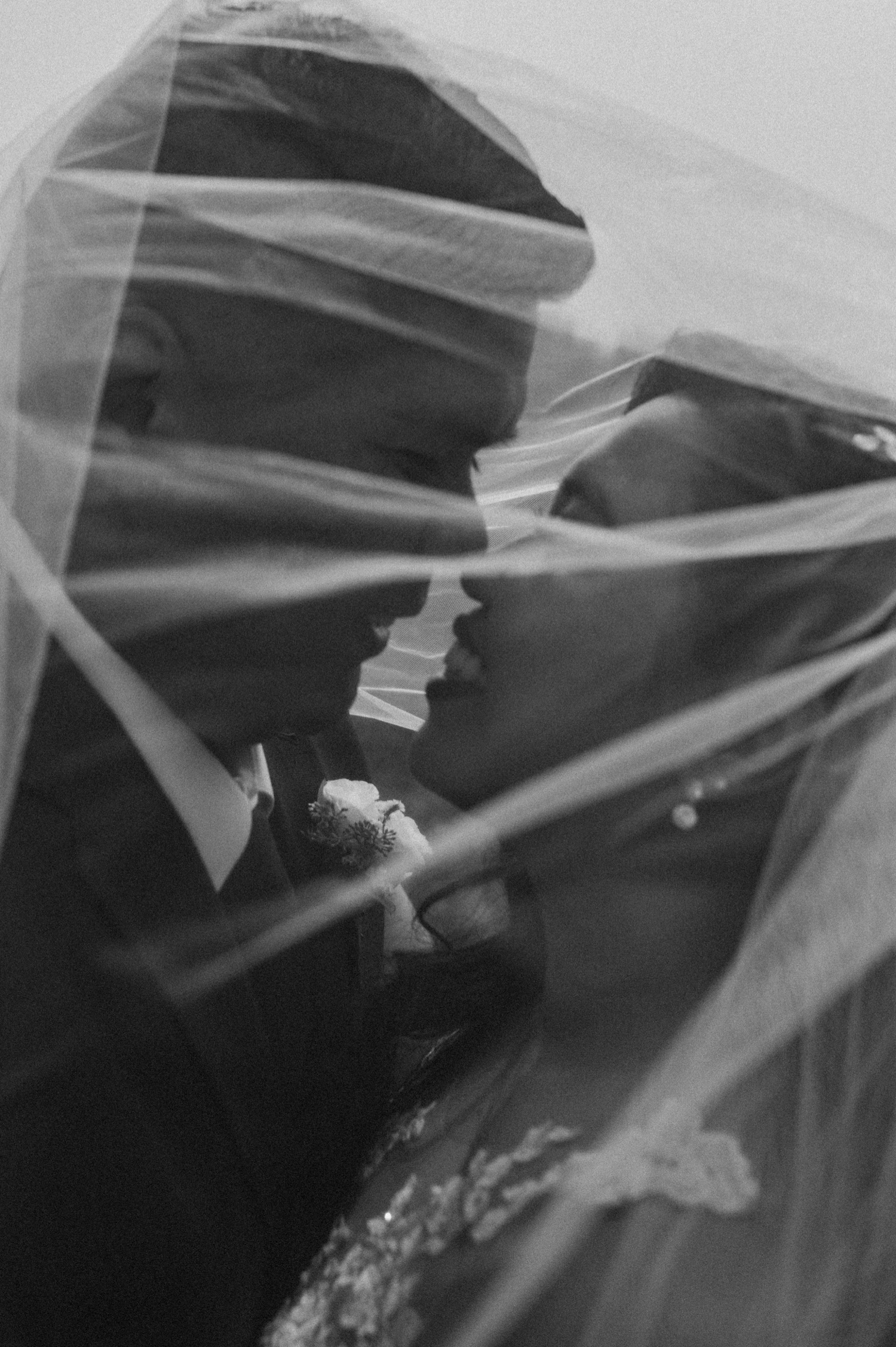 black and white veil shot of the bride and groom for a mountain elopement during wildfire season in Banff Alberta