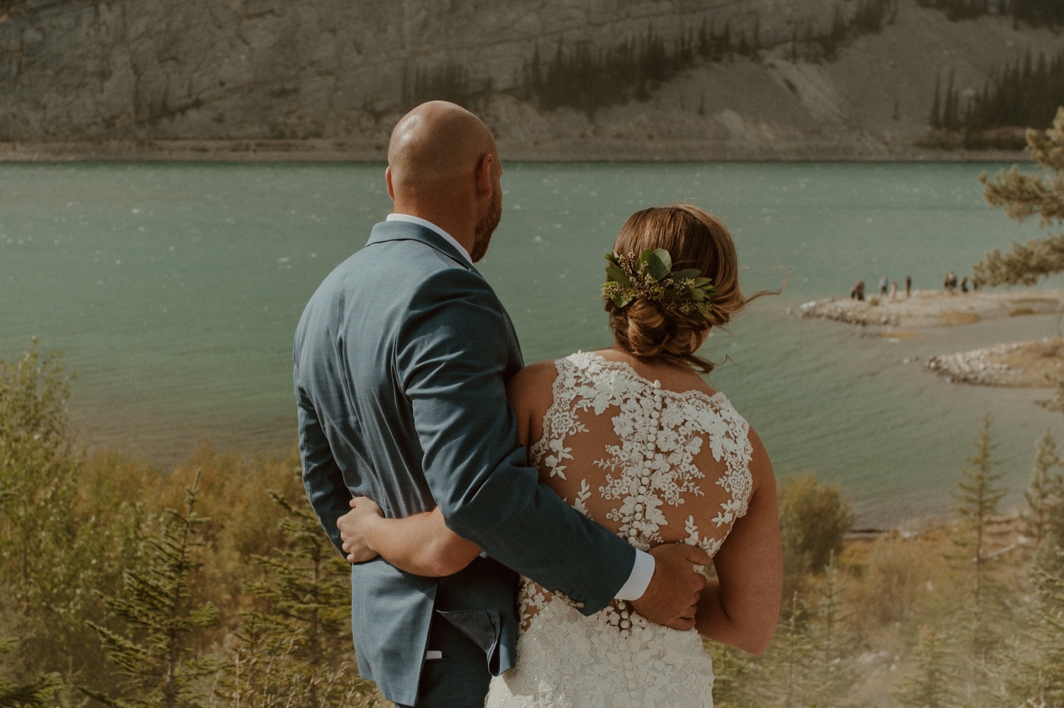 The bride and groom read private letters they wrote to each other before their elopement ceremony with family and friends in Kananaskis Alberta