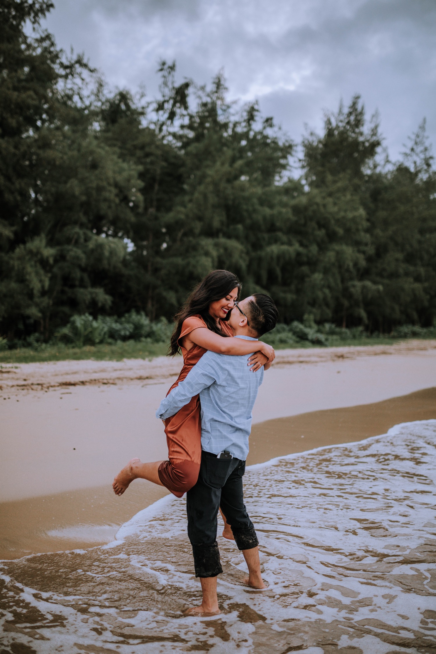 Kahana Bay Oahu Hawaii Engagement Session including posing ideas and outfit inspiration by Anela Benavides Photography