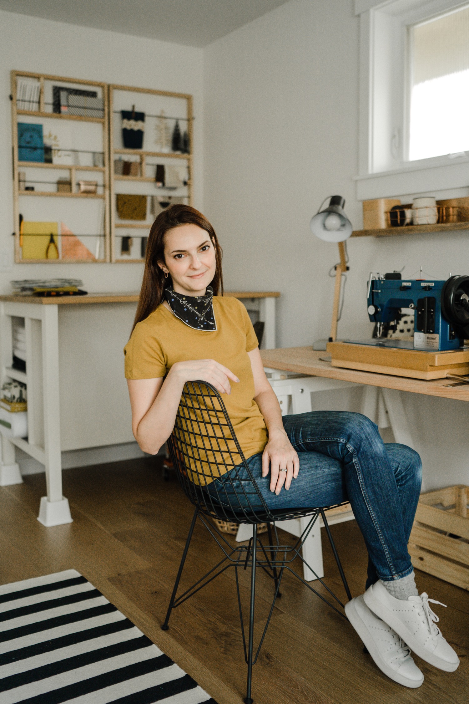 Woman sitting in chair in a craft studio