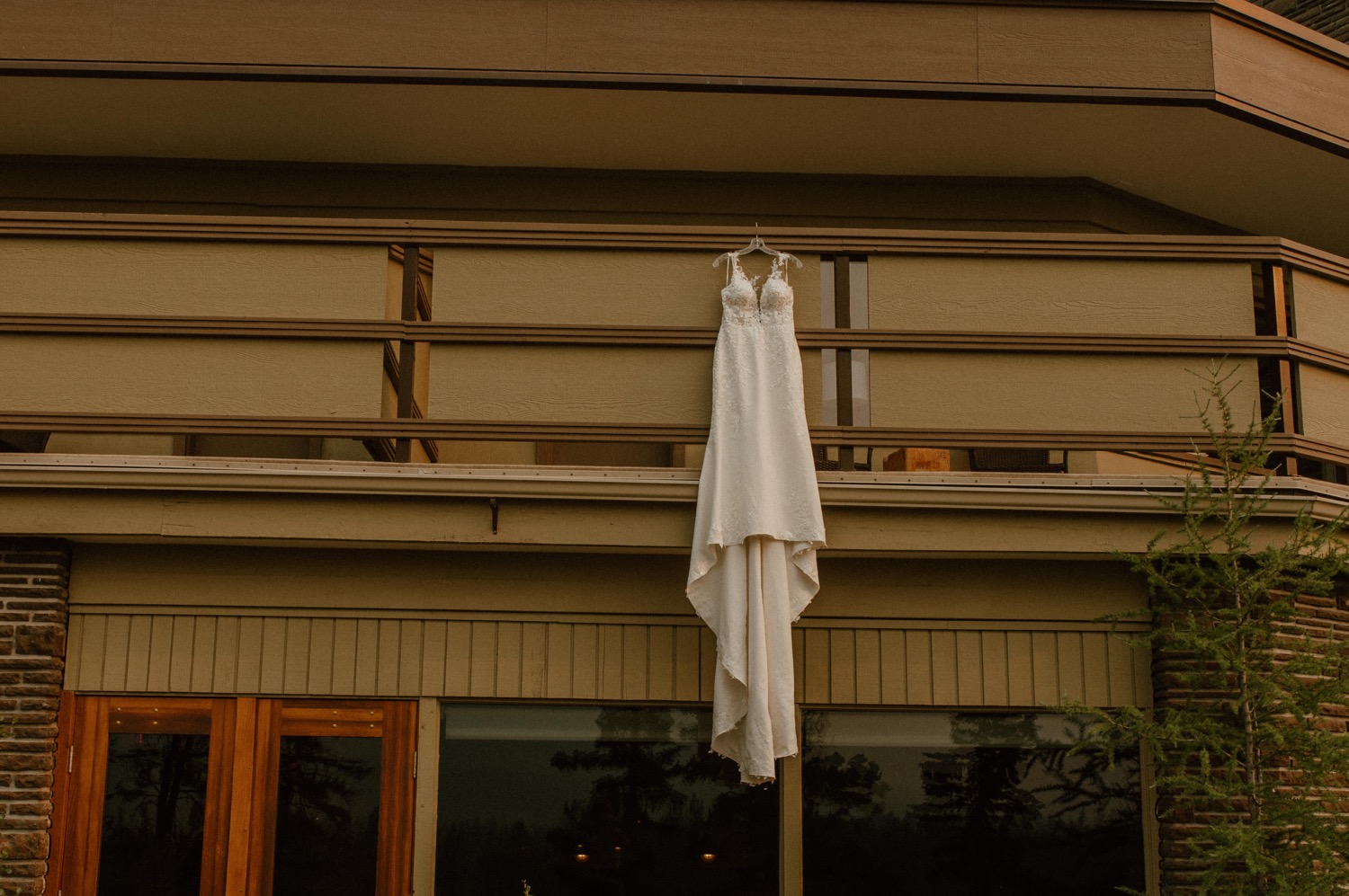 dress hanging from balcony of the Juniper Hotel setting for a mountain elopement during wildfire season in Banff Alberta