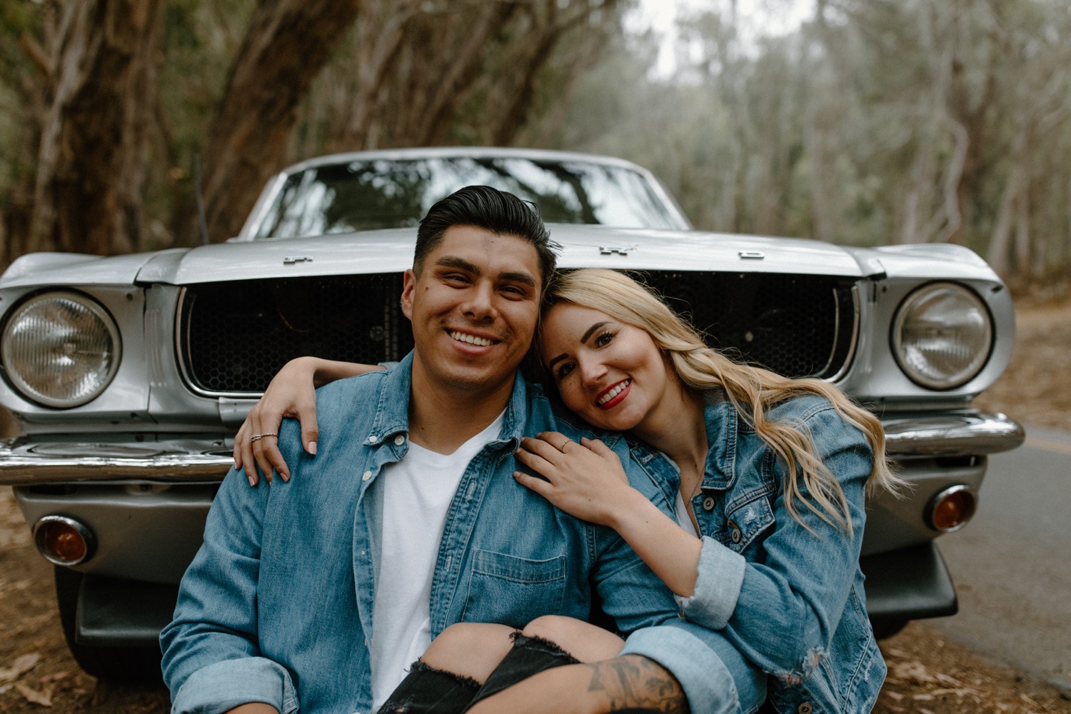 Free Photos - A Man And A Woman Standing Together In A Car Showroom. They  Are Smiling And Hugging Each Other Close, Conveying A Sense Of Affection  And Happiness. The Couple Is