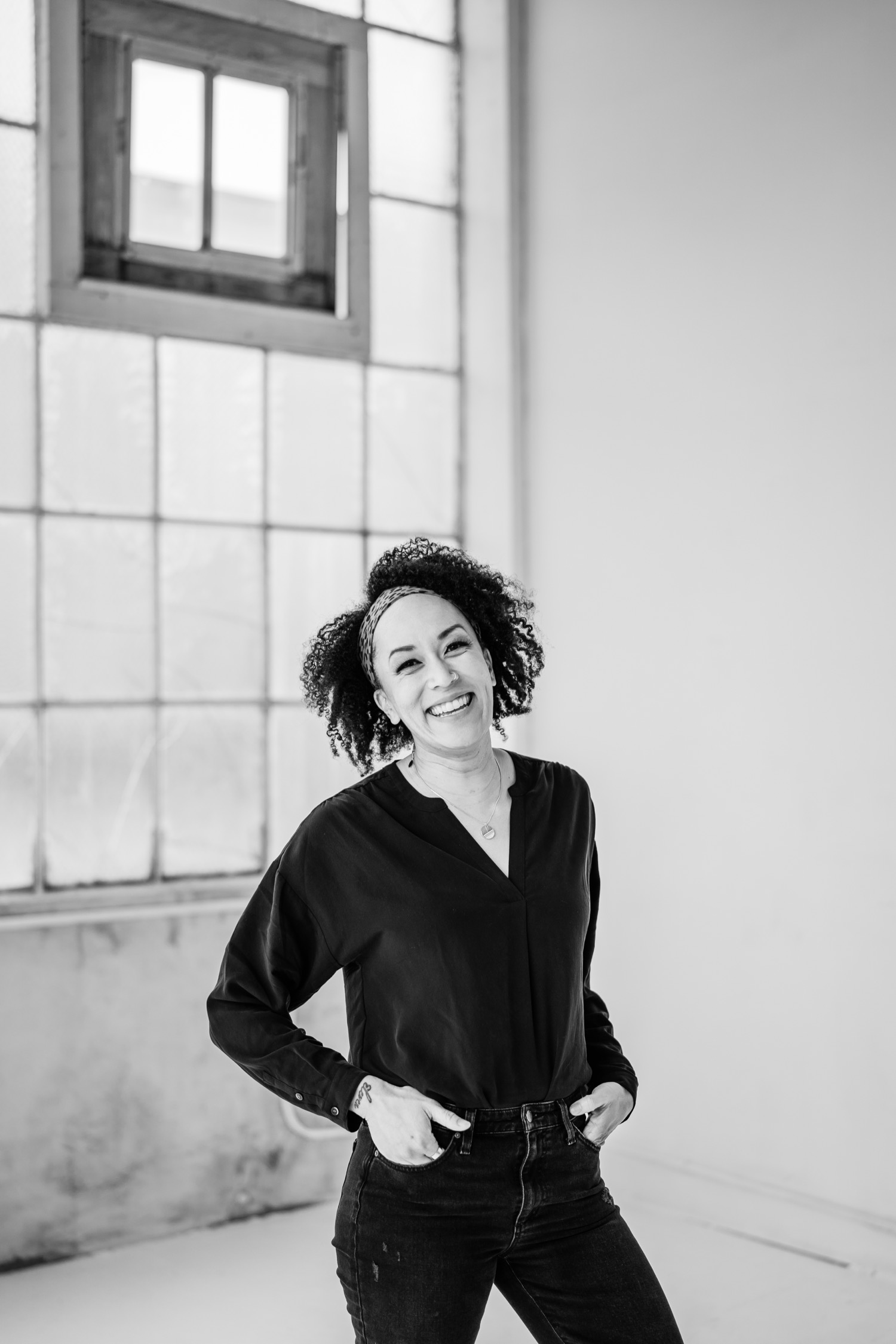 Black and white portrait with woman smiling and laughing