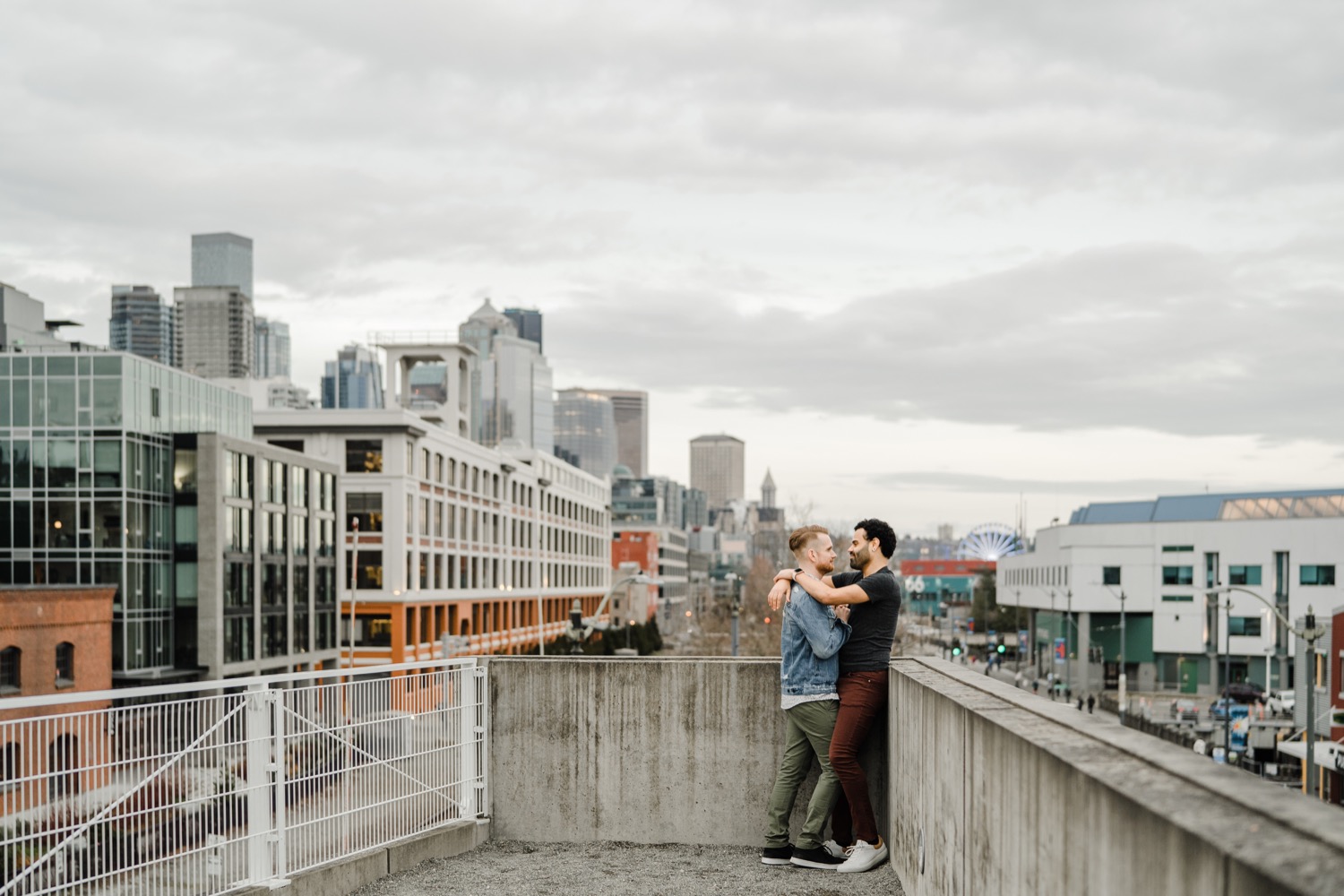 Couple embracing with view of the city in the background during couples session
