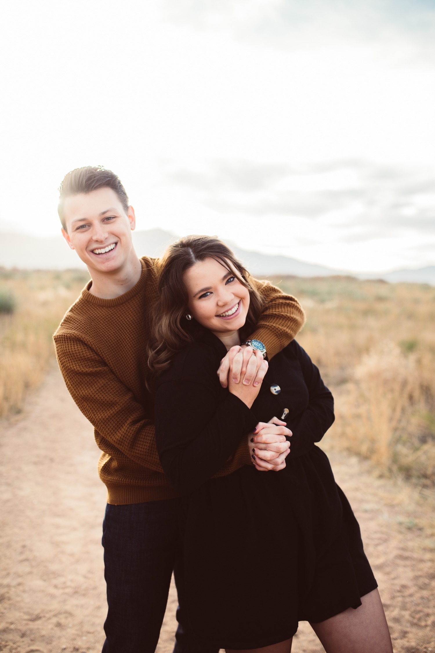 Photo of Candid shot of a happy couple from their Mehndi