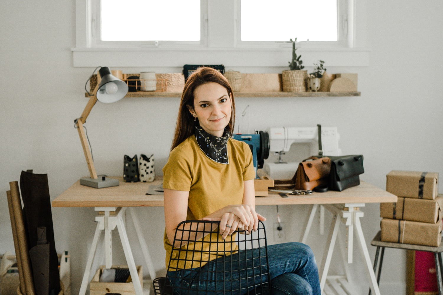 Woman sitting in chair in a craft studio
