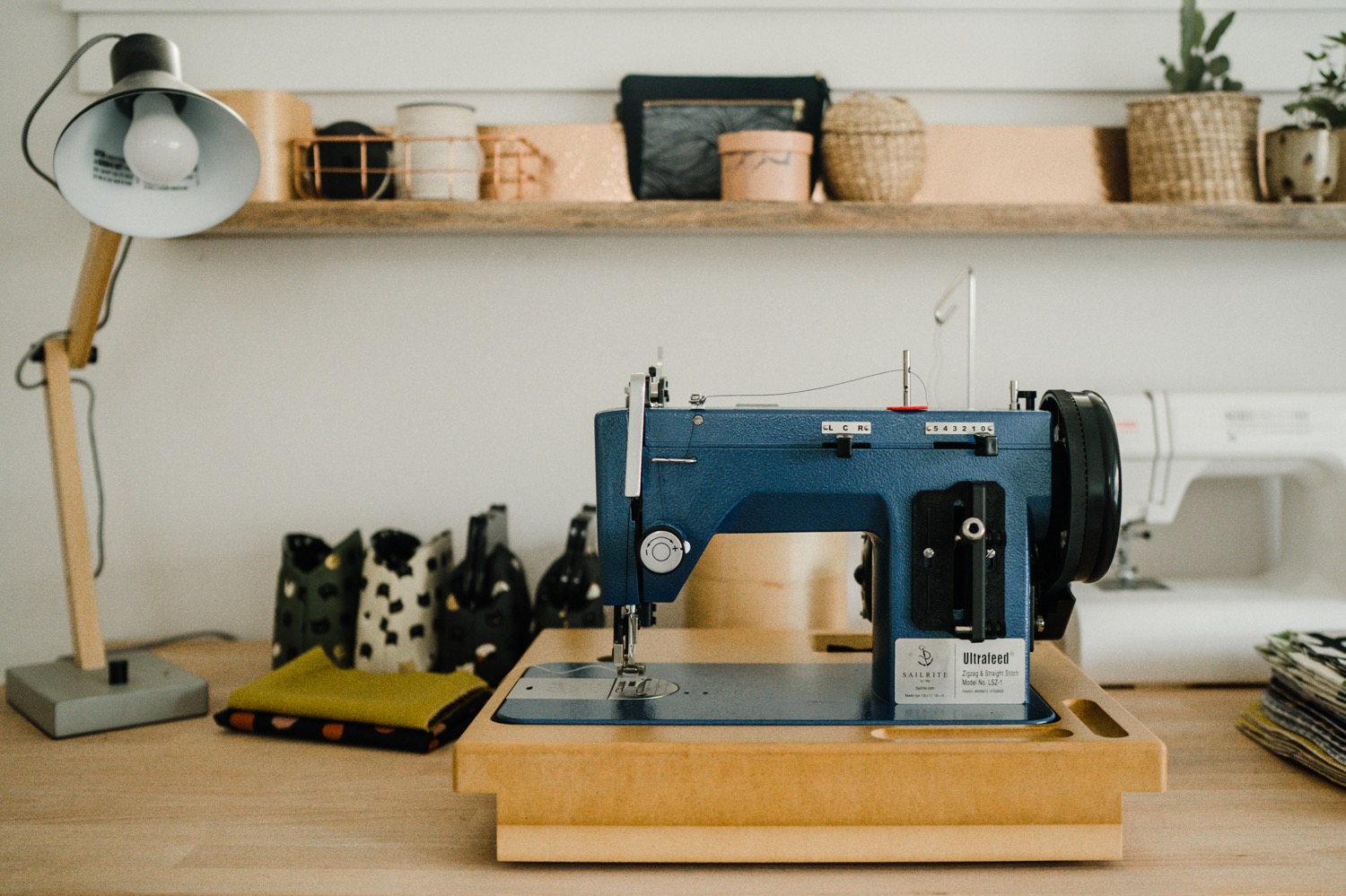 Blue sewing machine on desk