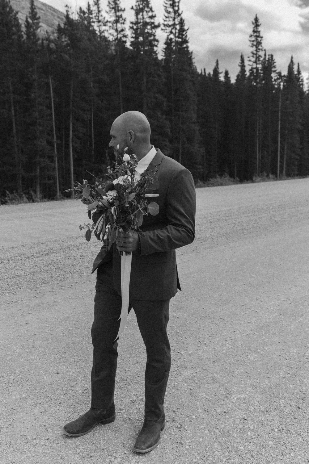 The groom waiting for his badass bride to make their way together to the ceremony in Kananaskis Alberta